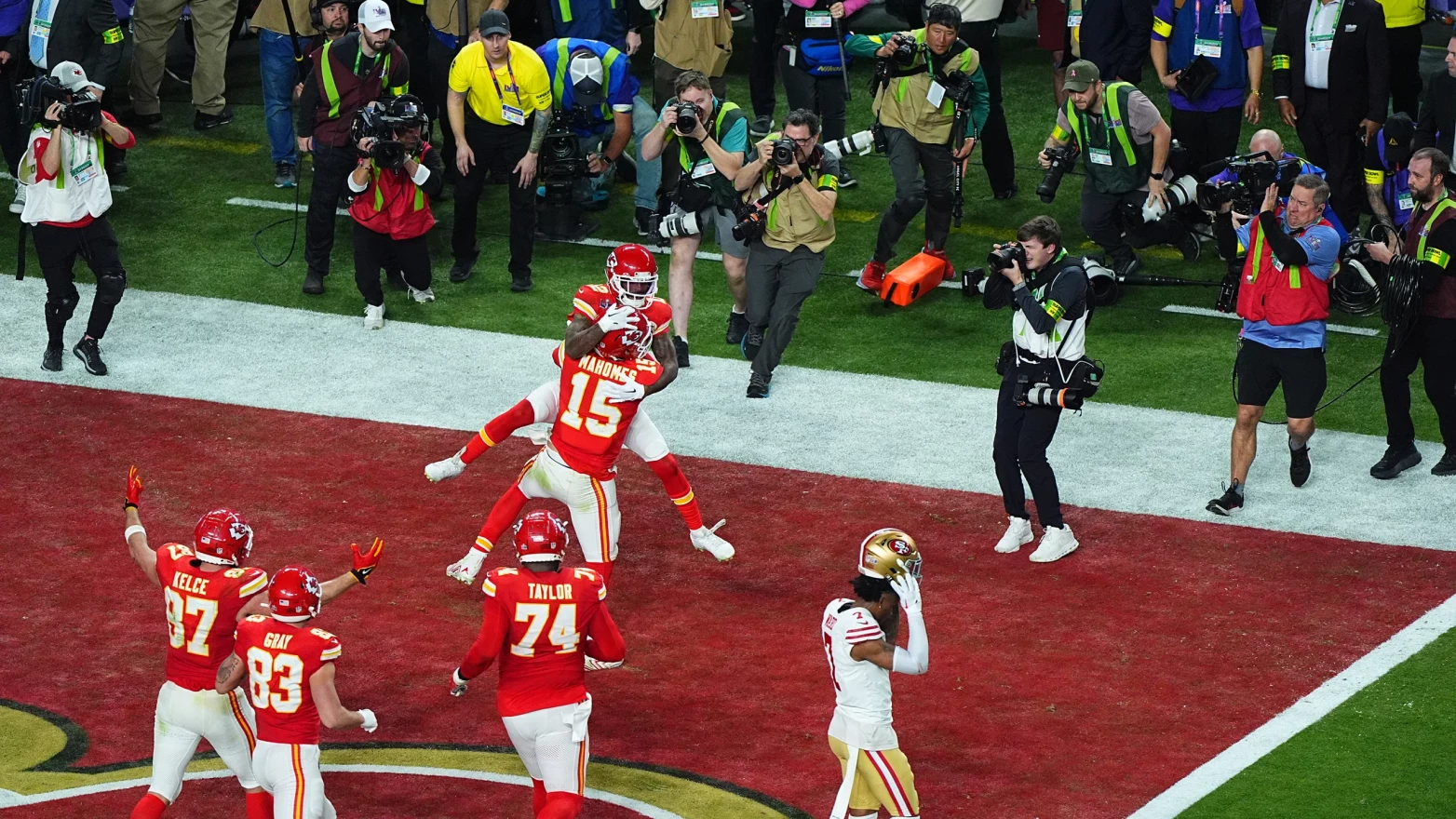 Kansas City Chiefs wide receiver Mecole Hardman Jr. celebrates in the end zone with quarterback Patrick Mahomes.